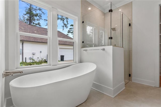 bathroom featuring tile patterned floors, plenty of natural light, and independent shower and bath