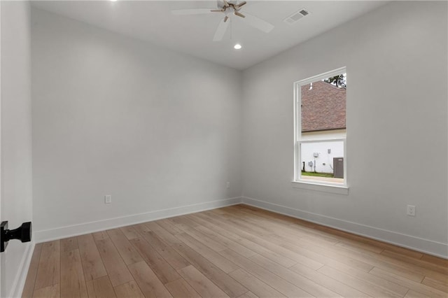 spare room featuring ceiling fan and light wood-type flooring