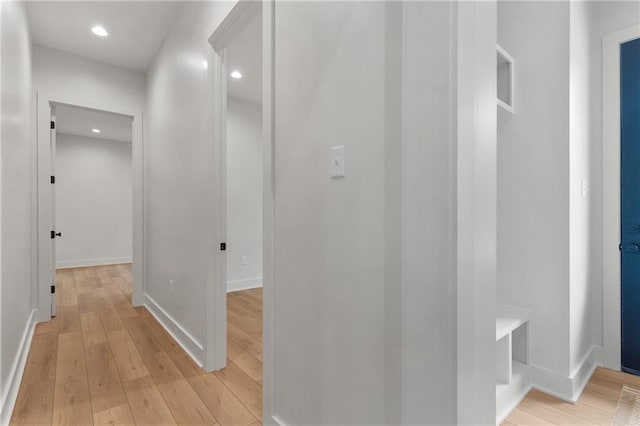 hall with light hardwood / wood-style floors