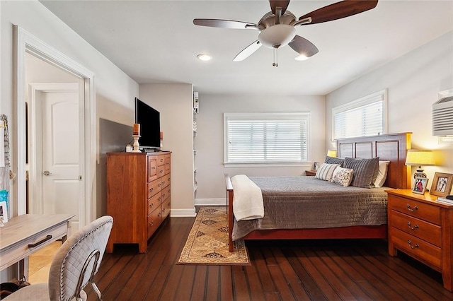 bedroom featuring ceiling fan and dark hardwood / wood-style floors