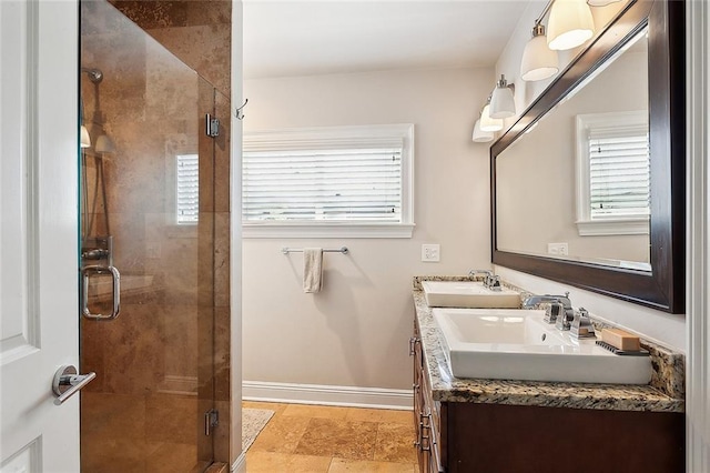 bathroom featuring vanity and a shower with shower door