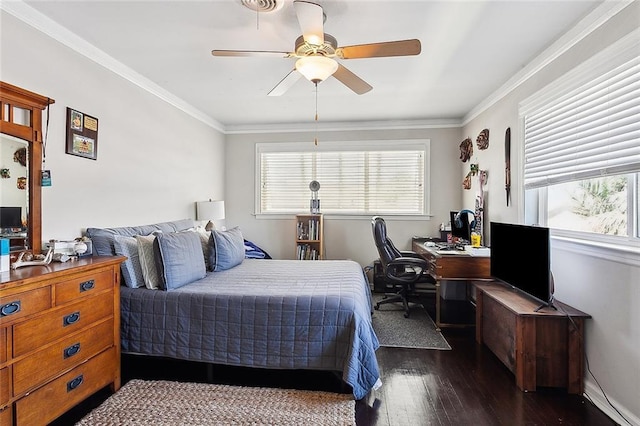 bedroom with dark hardwood / wood-style flooring, ceiling fan, and crown molding