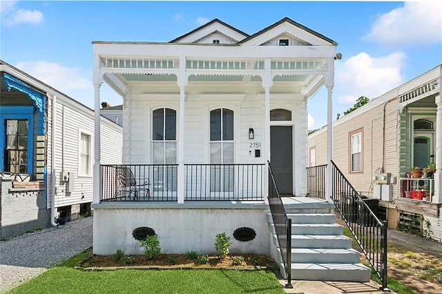 shotgun-style home with a porch