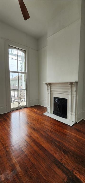 unfurnished living room with hardwood / wood-style floors and ceiling fan