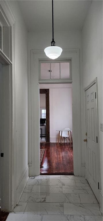 hallway with light hardwood / wood-style flooring