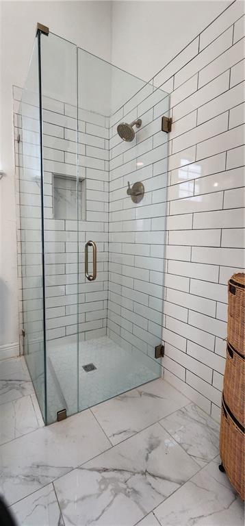 bathroom featuring an enclosed shower