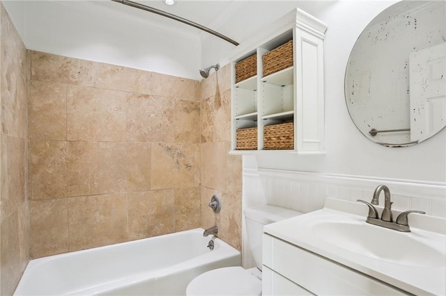 full bathroom with vanity, toilet, and tiled shower / bath