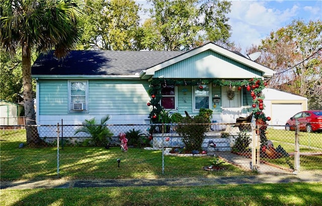 bungalow-style home with a porch, a garage, and a front lawn