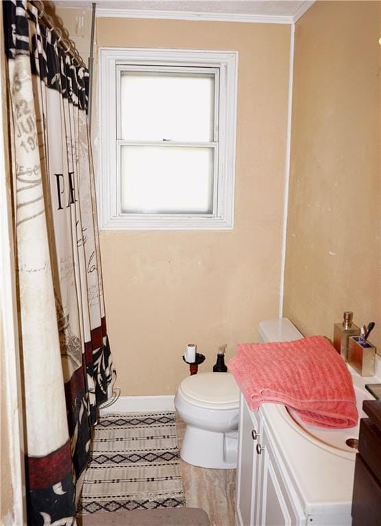 bathroom featuring tile patterned flooring, ornamental molding, toilet, vanity, and a shower with shower curtain