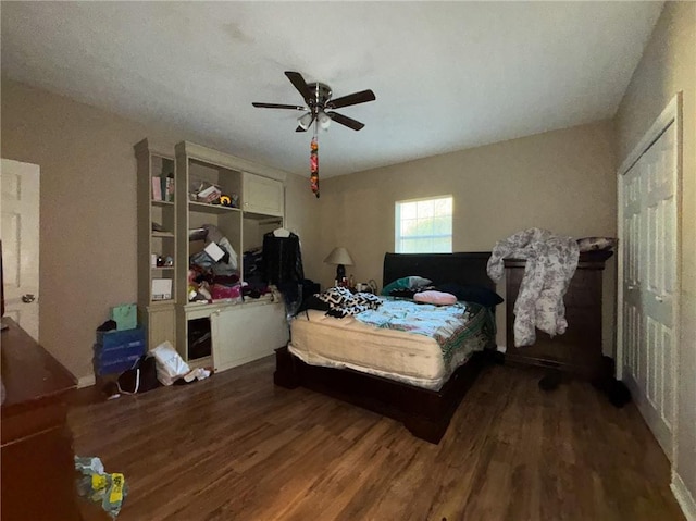 bedroom with ceiling fan and hardwood / wood-style floors