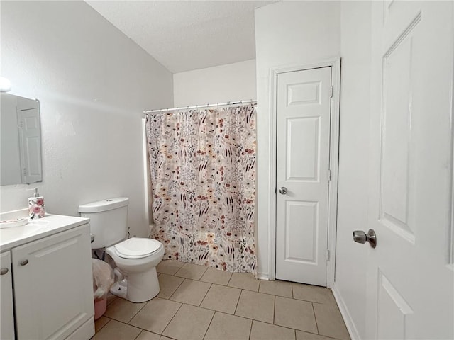 full bathroom with tile patterned flooring, a textured ceiling, toilet, vanity, and shower / tub combo