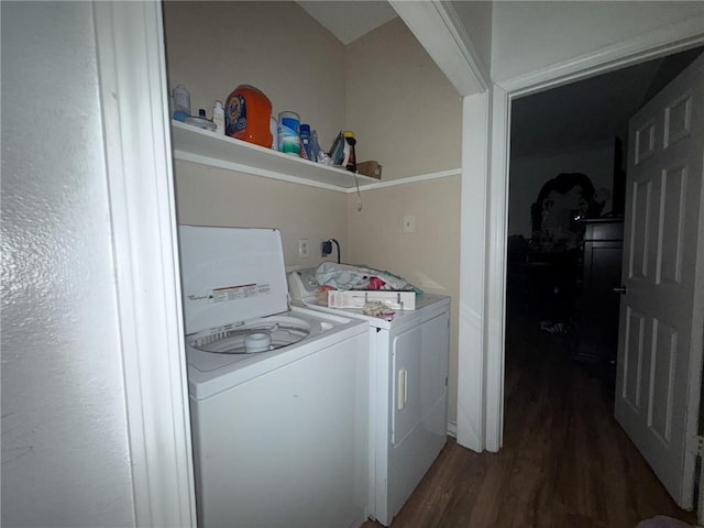 washroom with dark hardwood / wood-style flooring and separate washer and dryer