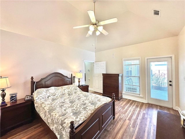 bedroom featuring dark wood-style floors, visible vents, baseboards, and a ceiling fan