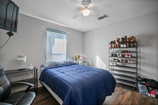 bedroom featuring ceiling fan and dark hardwood / wood-style floors