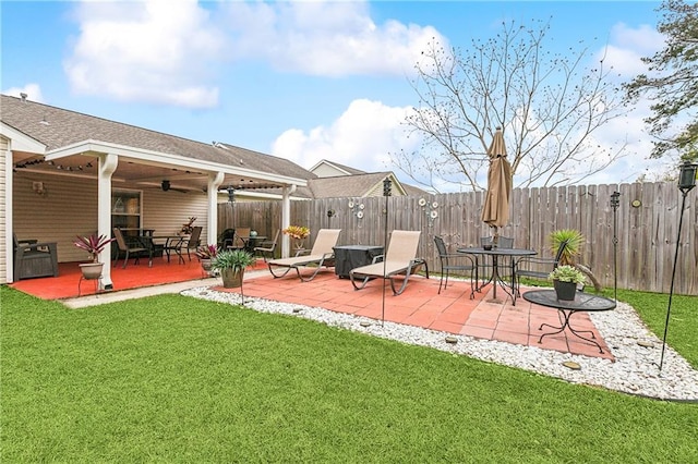 exterior space featuring ceiling fan and a patio area