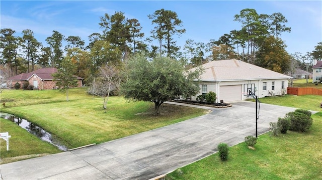 ranch-style home with a garage and a front yard