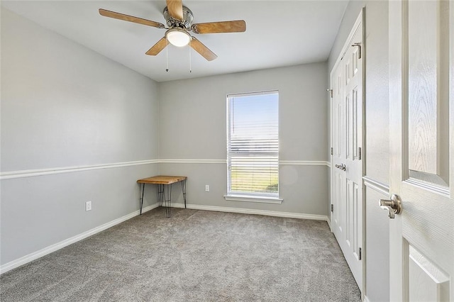 spare room with light carpet and ceiling fan