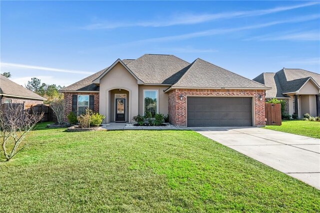 ranch-style home with a garage and a front lawn