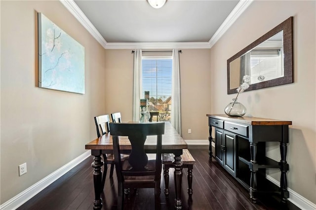 dining room with ornamental molding and dark wood-type flooring