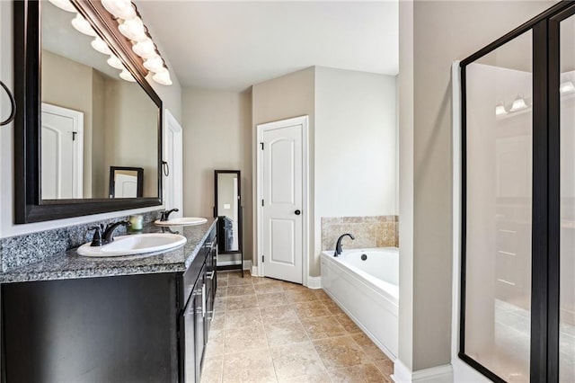 bathroom featuring vanity and plus walk in shower