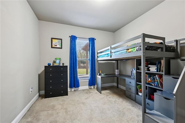 bedroom featuring light colored carpet