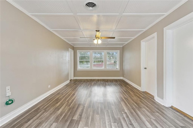 empty room with ceiling fan, wood-type flooring, and coffered ceiling