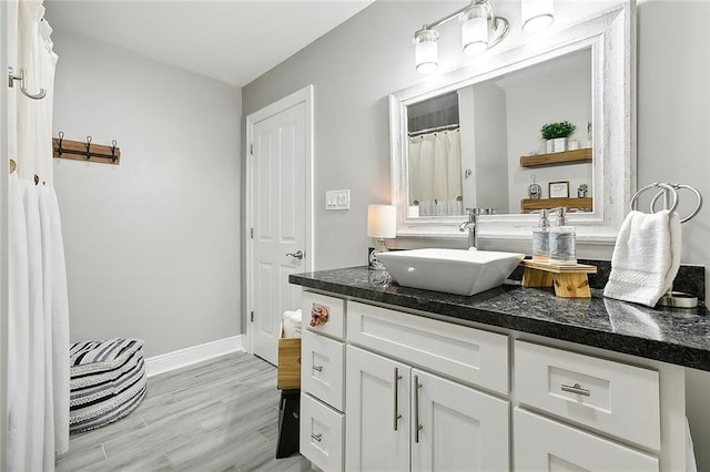 bathroom with vanity and hardwood / wood-style flooring