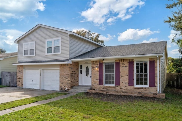 split level home featuring a garage and a front yard