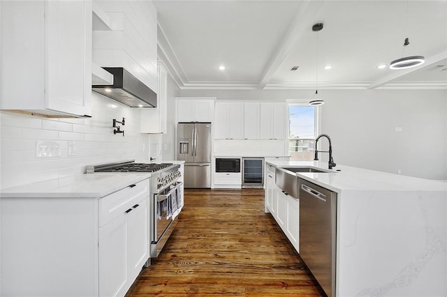 kitchen featuring pendant lighting, wall chimney exhaust hood, dark hardwood / wood-style floors, appliances with stainless steel finishes, and white cabinetry