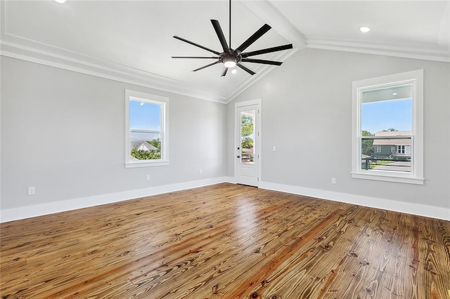 spare room with hardwood / wood-style flooring, lofted ceiling with beams, ceiling fan, and crown molding