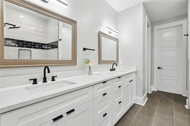 bathroom featuring tile patterned floors, vanity, and tiled shower