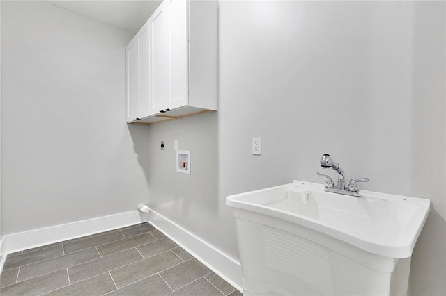 laundry room with cabinets, hookup for a washing machine, electric dryer hookup, and sink