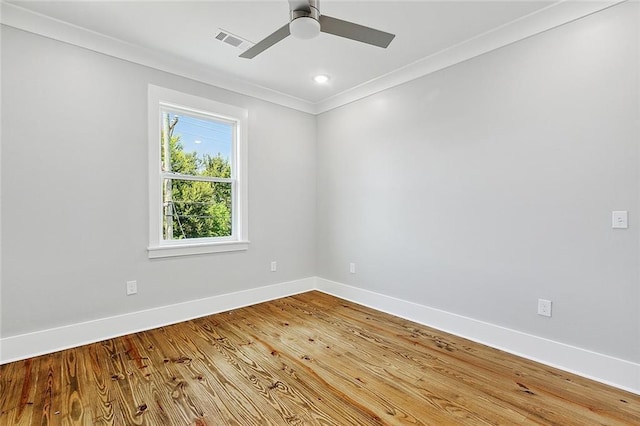 spare room featuring crown molding, ceiling fan, and hardwood / wood-style flooring