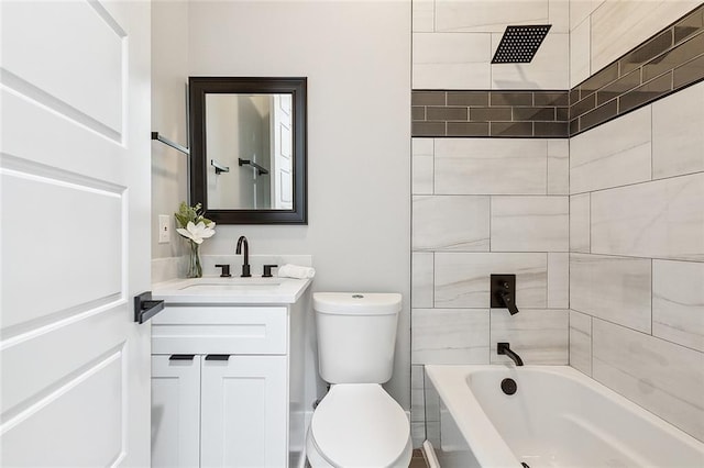 full bathroom featuring vanity, toilet, and tiled shower / bath combo