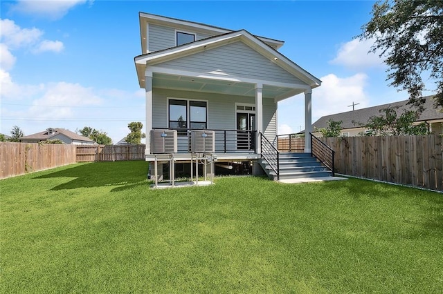 back of house featuring a yard