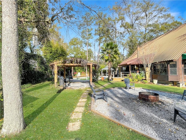 view of yard with a gazebo and an outdoor fire pit