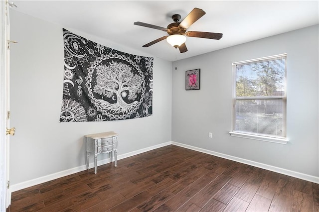 unfurnished room with ceiling fan and dark hardwood / wood-style flooring