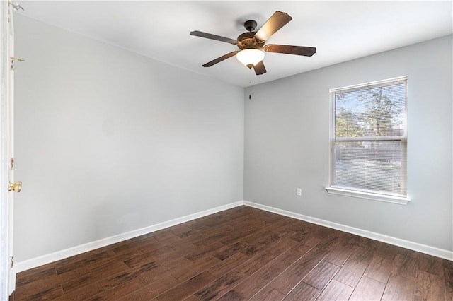 unfurnished room featuring ceiling fan and dark wood-type flooring