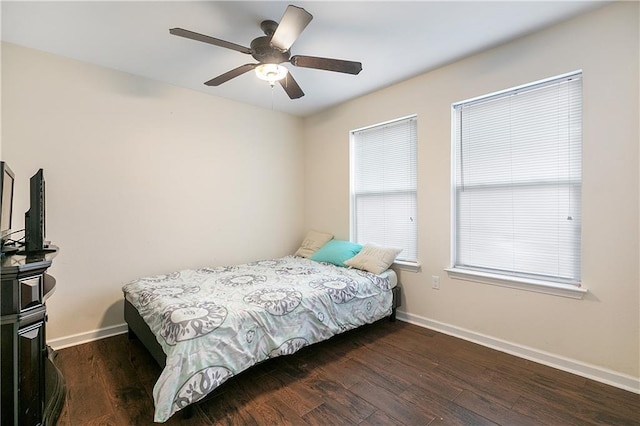 bedroom featuring dark hardwood / wood-style floors and ceiling fan