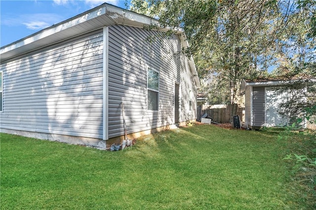 view of home's exterior with a lawn