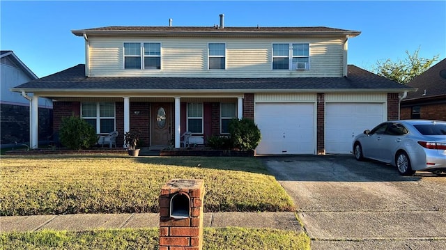 view of front property with a garage and a front lawn