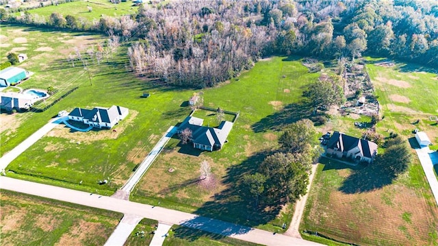 birds eye view of property with a rural view