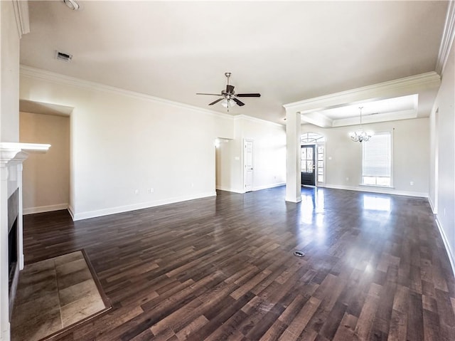 unfurnished living room with ceiling fan with notable chandelier, dark hardwood / wood-style flooring, and ornamental molding