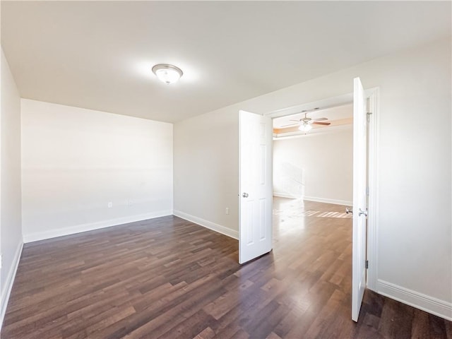 unfurnished room featuring dark hardwood / wood-style flooring