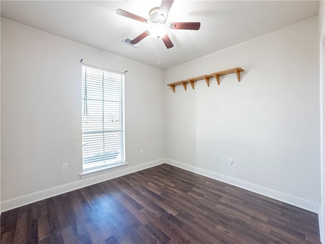 unfurnished room featuring dark hardwood / wood-style floors and ceiling fan