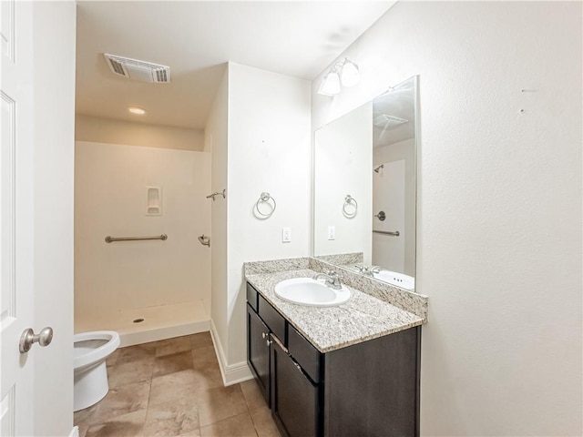 bathroom with tile patterned floors, vanity, toilet, and a shower