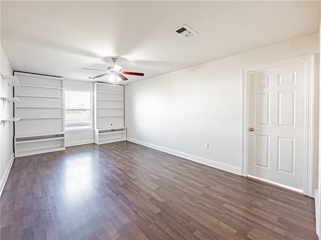 unfurnished bedroom with ceiling fan and dark hardwood / wood-style flooring