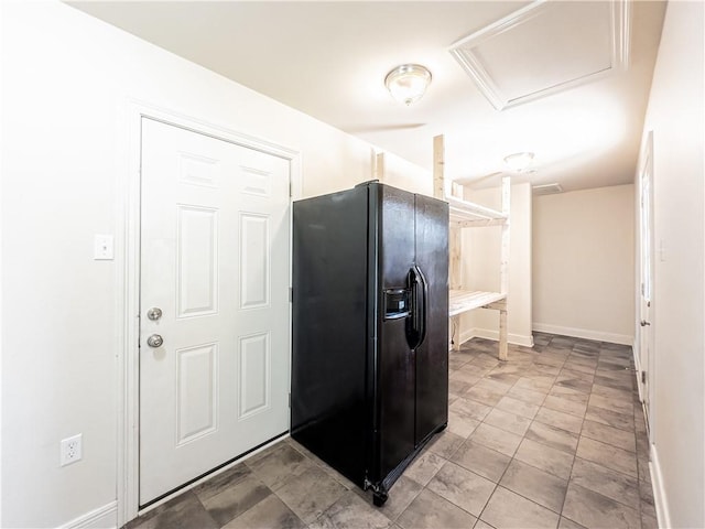 kitchen featuring black fridge with ice dispenser