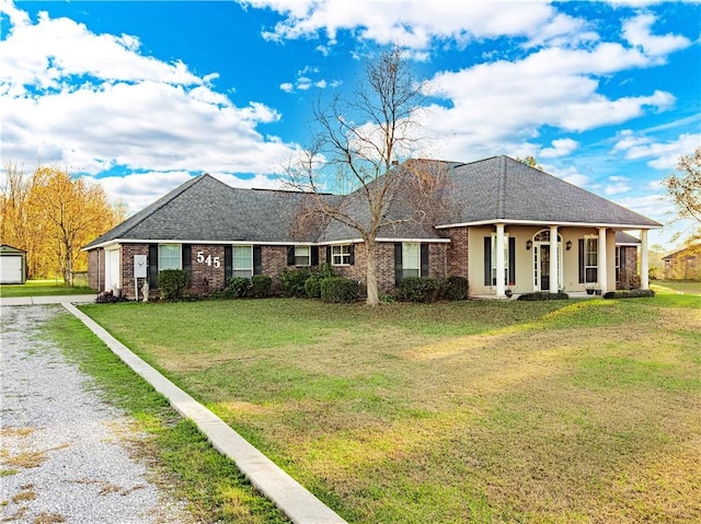 ranch-style house with a garage and a front lawn