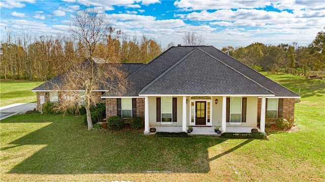 view of front of home featuring covered porch and a front lawn